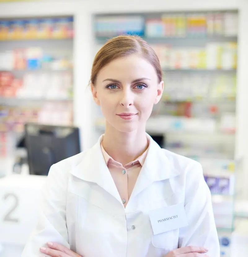 Female pharmacist with folded arms